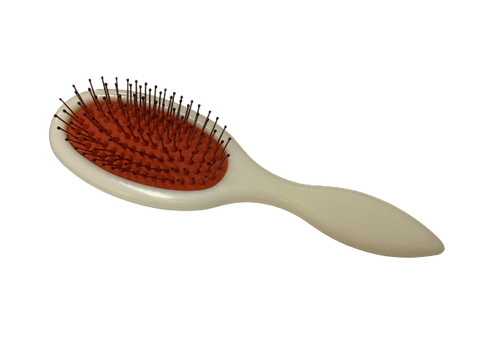 Beige hairbrush with red bristle head on a white background