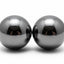Two metallic spheres on a white background