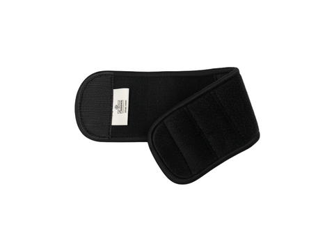 Black wrist band with a visible brand label on a white background
