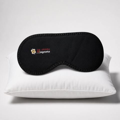 Premium Magnetic Eye Mask, A black magnetic sleep mask with the 'DR. SIERRA Magnets' logo, resting on a white pillow against a light gray background.