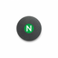 A round, dark gray brushed metal button or badge featuring a green circular center with a white letter 'N', shown on a plain white background.