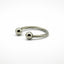 Silver ring with two spherical ends on a white background